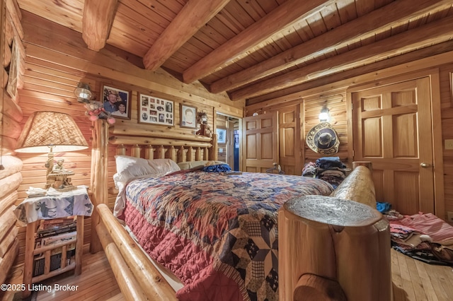 905 Camp Greenshores Rd, Mcdaniels, KY 40152 - bedroom featuring wood walls, light wood-style floors, and a wooden ceiling with exposed beams