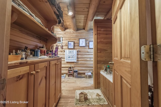 905 Camp Greenshores Rd, Mcdaniels, KY 40152 - bathroom with rustic walls, a wooden ceiling with exposed beams, and hardwood / wood-style floors