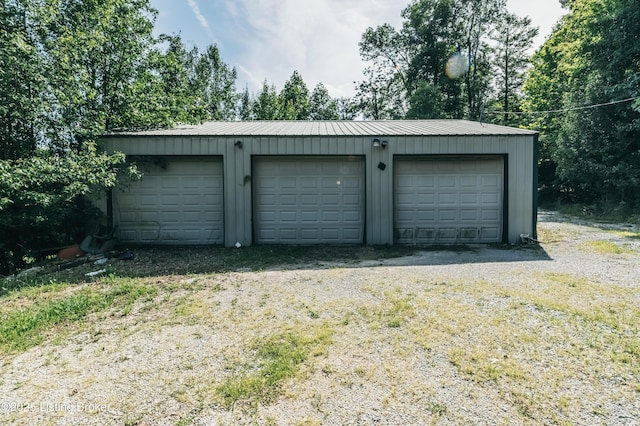 905 Camp Greenshores Rd, Mcdaniels, KY 40152 - detached garage with view of wooded area