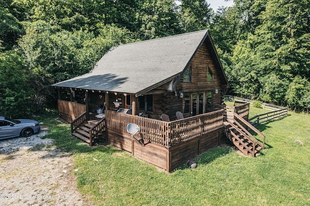 905 Camp Greenshores Rd, Mcdaniels, KY 40152 - cabin with a front lawn, log siding, a shingled roof, and a forest view