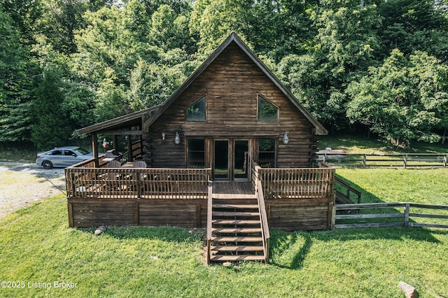 905 Camp Greenshores Rd, Mcdaniels, KY 40152 - view of front of house featuring log siding, a deck, and a view of trees