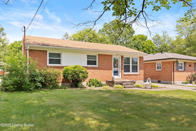 10608 Charlene Dr, Fairdale, KY 40118 - view of front of home with brick siding, a front lawn, and roof with shingles