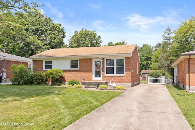 10608 Charlene Dr, Fairdale, KY 40118 - view of front of home featuring brick siding, driveway, and roof with shingles