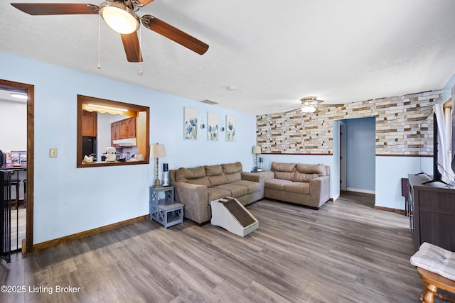 10608 Charlene Dr, Fairdale, KY 40118 - living room with ceiling fan, wood finished floors, and baseboards