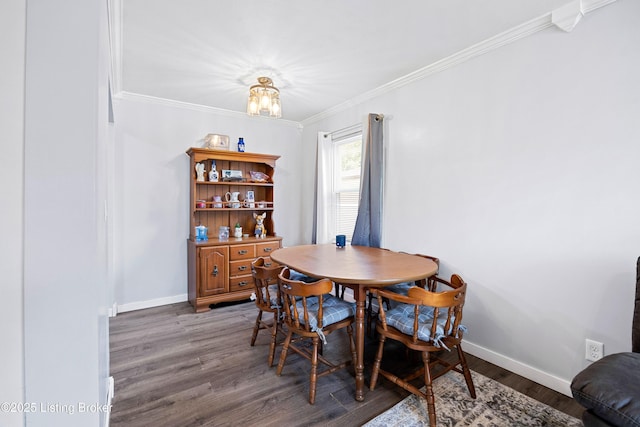 10608 Charlene Dr, Fairdale, KY 40118 - dining room featuring dark wood-type flooring, ornamental molding, baseboards, and a chandelier