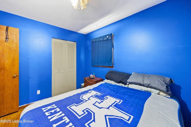 10608 Charlene Dr, Fairdale, KY 40118 - bedroom featuring wood finished floors, a closet, and baseboards