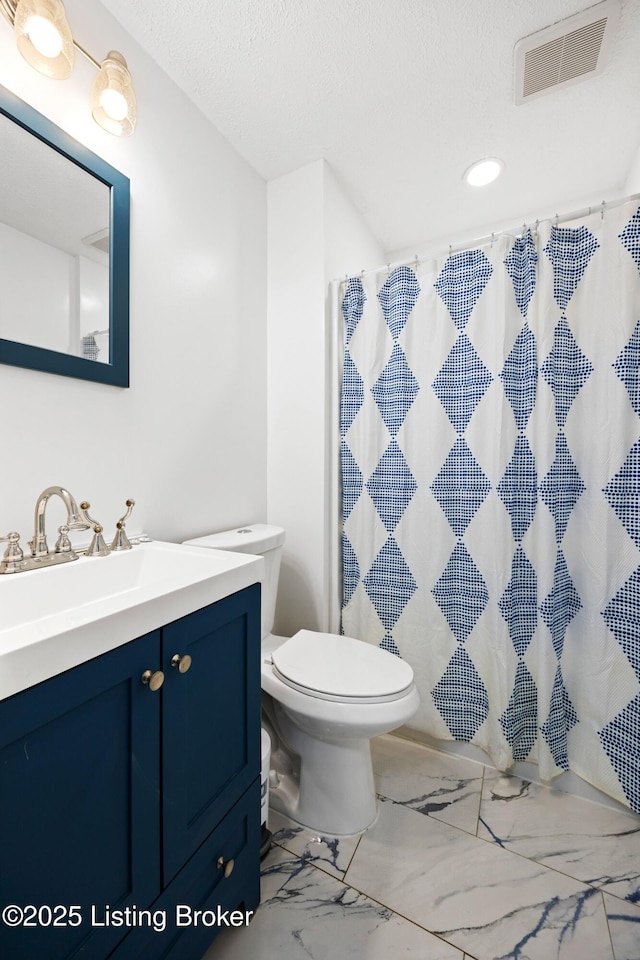 10608 Charlene Dr, Fairdale, KY 40118 - full bathroom featuring vanity, toilet, marble look tiles, a textured ceiling, and recessed lighting