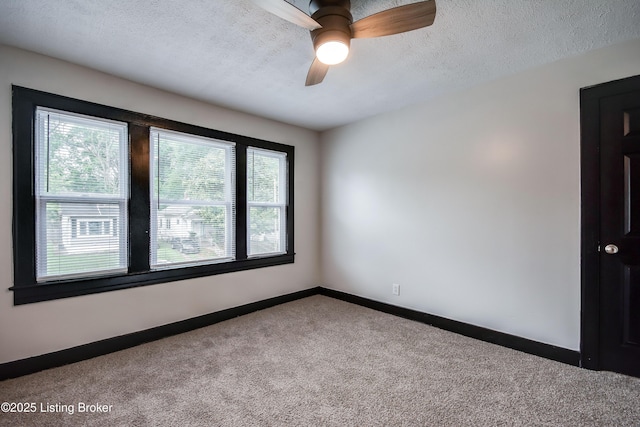 825 S 42nd St, Louisville, KY 40211 - unfurnished room featuring healthy amount of natural light, carpet flooring, baseboards, a textured ceiling, and ceiling fan