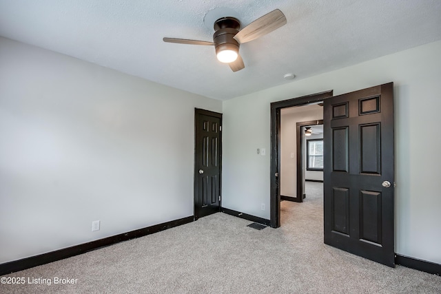 825 S 42nd St, Louisville, KY 40211 - spare room with a ceiling fan, light carpet, and baseboards