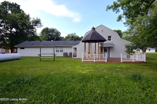8201 Damascus Rd, Louisville, KY 40228 - back of house with a lawn, cooling unit, and a deck
