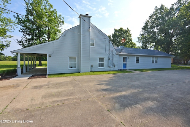 8201 Damascus Rd, Louisville, KY 40228 - rear view of house with a chimney