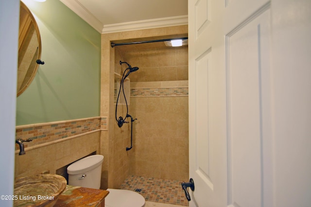 8201 Damascus Rd, Louisville, KY 40228 - bathroom featuring a shower stall, toilet, tile walls, a wainscoted wall, and crown molding