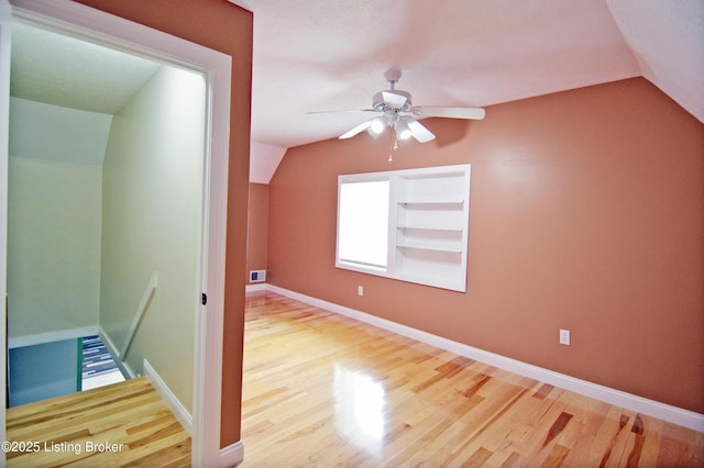 8201 Damascus Rd, Louisville, KY 40228 - additional living space with lofted ceiling, wood finished floors, ceiling fan, and baseboards
