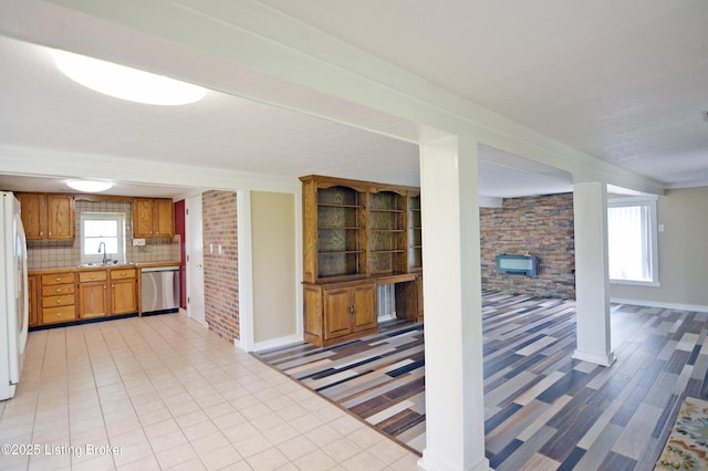 8201 Damascus Rd, Louisville, KY 40228 - kitchen featuring dishwasher, a sink, light countertops, and baseboards