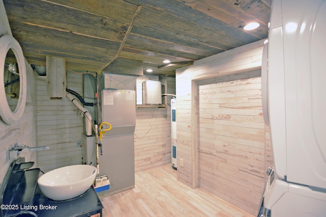 8201 Damascus Rd, Louisville, KY 40228 - bathroom with wood finished floors, water heater, wood walls, heating unit, and vanity