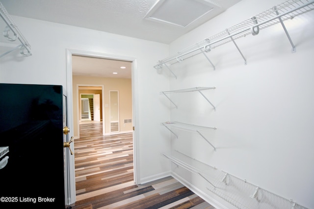 8201 Damascus Rd, Louisville, KY 40228 - walk in closet with wood finished floors and attic access