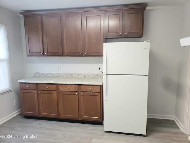 1020 Stanley Ave, Louisville, KY 40215 - kitchen featuring freestanding refrigerator, baseboards, and light wood-type flooring
