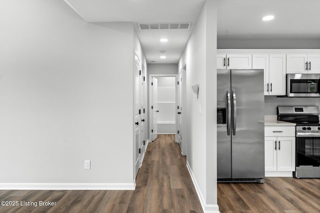 5482 Bagdad Rd, Bagdad, KY 40003 - kitchen with appliances with stainless steel finishes, dark wood-style floors, white cabinetry, recessed lighting, and light countertops