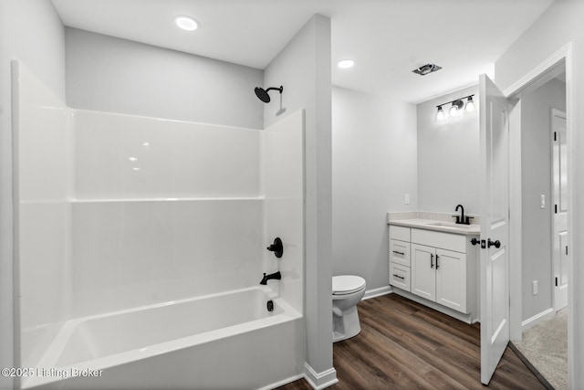 5482 Bagdad Rd, Bagdad, KY 40003 - bathroom featuring vanity, toilet, shower / washtub combination, wood finished floors, and baseboards