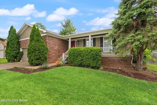 12409 Ledges Dr, Louisville, KY 40243 - view of front facade featuring covered porch, brick siding, a front yard, and an attached garage