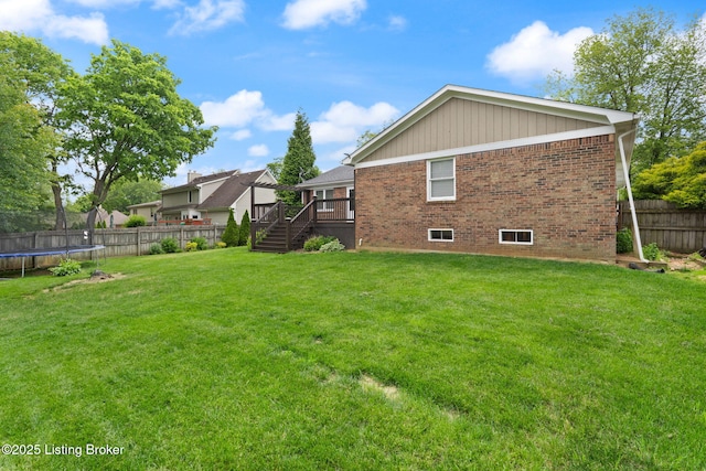 12409 Ledges Dr, Louisville, KY 40243 - view of yard with a trampoline, stairway, and a deck