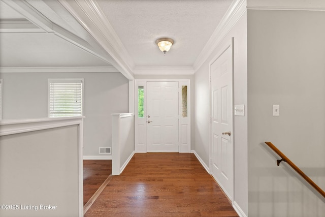 12409 Ledges Dr, Louisville, KY 40243 - foyer with healthy amount of natural light, wood finished floors, crown molding, a textured ceiling, and baseboards