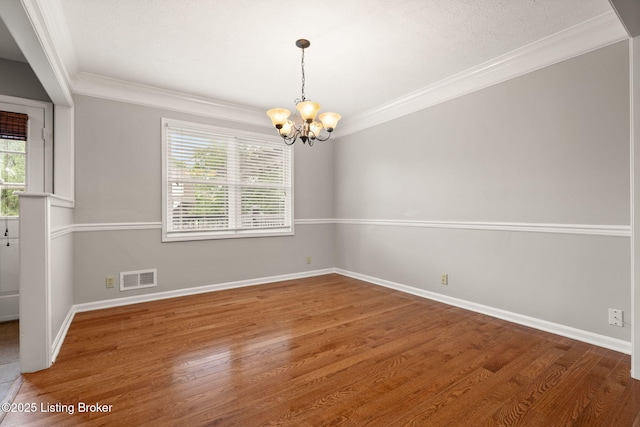 12409 Ledges Dr, Louisville, KY 40243 - empty room featuring a chandelier, crown molding, baseboards, and wood finished floors