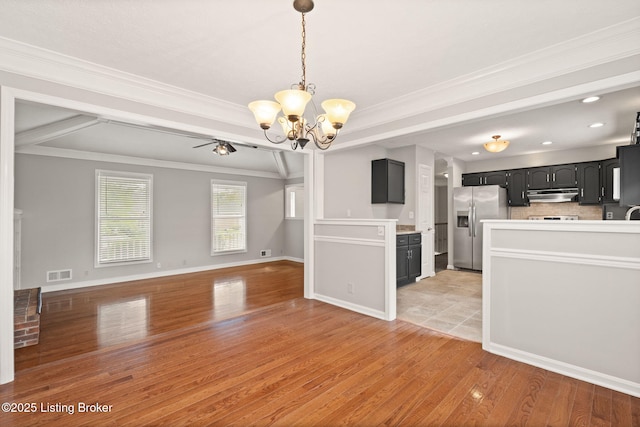 12409 Ledges Dr, Louisville, KY 40243 - unfurnished living room featuring a chandelier, light wood-style flooring, crown molding, baseboards, and recessed lighting