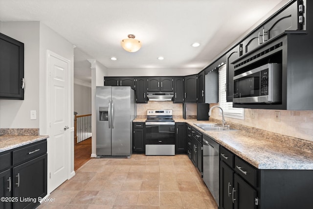 12409 Ledges Dr, Louisville, KY 40243 - kitchen featuring appliances with stainless steel finishes, under cabinet range hood, a sink, decorative backsplash, and recessed lighting