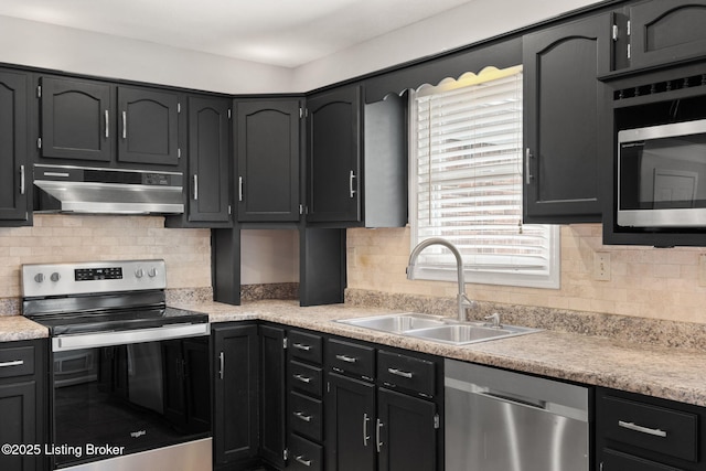 12409 Ledges Dr, Louisville, KY 40243 - kitchen featuring appliances with stainless steel finishes, under cabinet range hood, a sink, light countertops, and tasteful backsplash