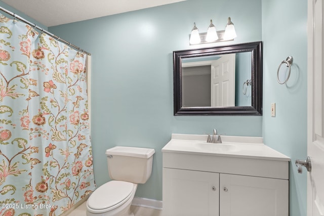 12409 Ledges Dr, Louisville, KY 40243 - bathroom with vanity, toilet, a shower with shower curtain, and baseboards