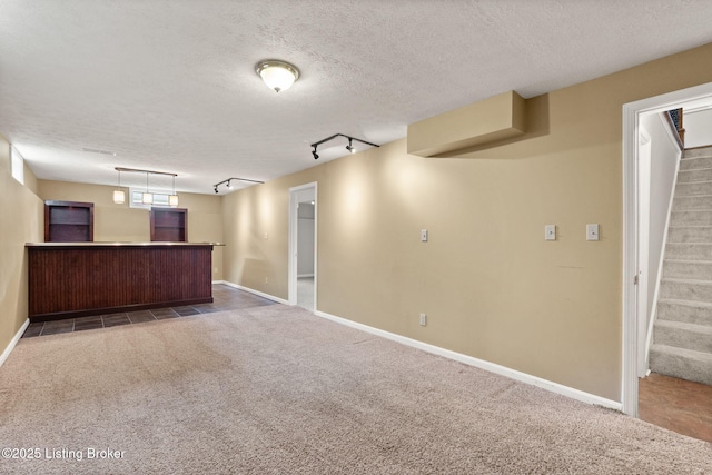 12409 Ledges Dr, Louisville, KY 40243 - finished below grade area featuring bar area, stairs, carpet floors, a textured ceiling, and track lighting