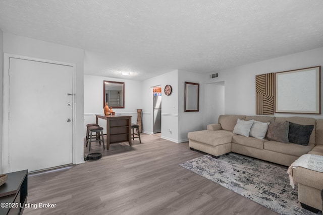 10 Dupont Way Unit 6, Louisville, KY 40207 - living area with wood finished floors and a textured ceiling