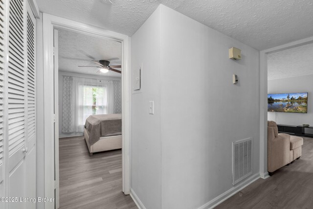 10 Dupont Way Unit 6, Louisville, KY 40207 - hall with a textured ceiling and wood finished floors