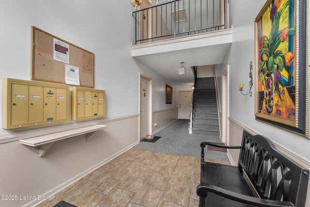 10 Dupont Way Unit 6, Louisville, KY 40207 - corridor with stairway, mail area, a towering ceiling, stone finish floors, and carpet flooring