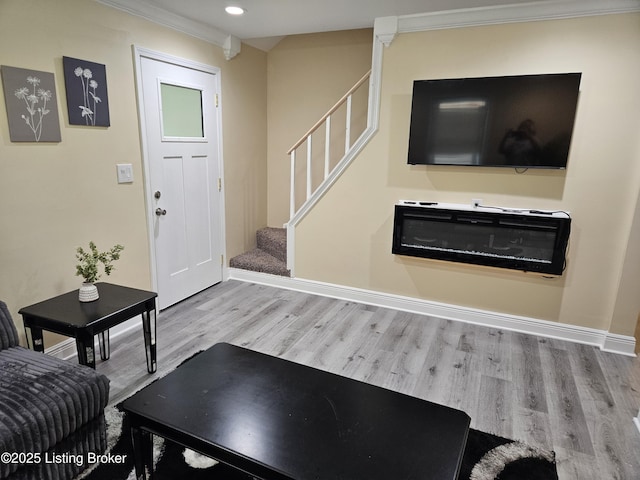 1165 Lincoln Ave, Louisville, KY 40208 - living area with stairway, wood finished floors, crown molding, recessed lighting, and baseboards