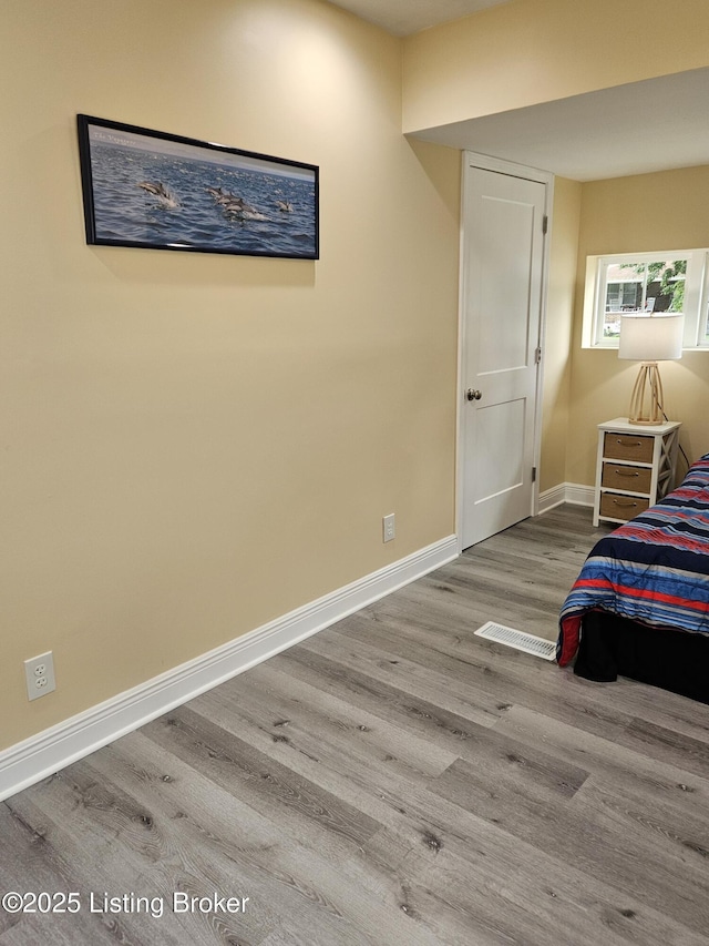 1165 Lincoln Ave, Louisville, KY 40208 - bedroom with wood finished floors and baseboards