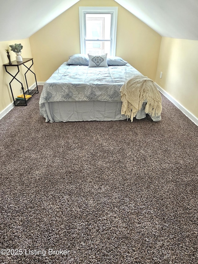 1165 Lincoln Ave, Louisville, KY 40208 - bedroom with baseboards, vaulted ceiling, and carpet flooring