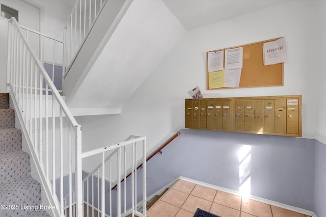 1008 Lake Way Unit D12, Louisville, KY 40222 - stairs featuring vaulted ceiling, tile patterned floors, and mail area