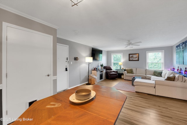 1008 Lake Way Unit D12, Louisville, KY 40222 - dining area featuring a ceiling fan, wood finished floors, and crown molding