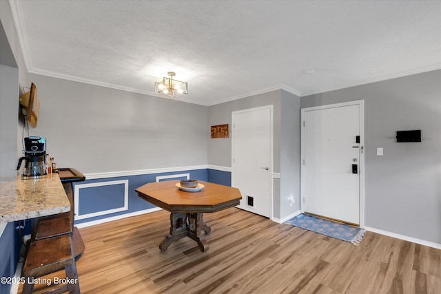 1008 Lake Way Unit D12, Louisville, KY 40222 - dining area with light wood-style floors, crown molding, and baseboards