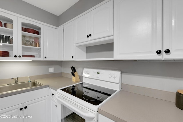 1008 Lake Way Unit D12, Louisville, KY 40222 - kitchen featuring white range with electric cooktop, a sink, white cabinetry, and light countertops