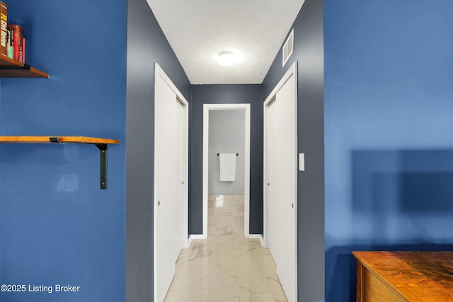 1008 Lake Way Unit D12, Louisville, KY 40222 - hall featuring light marble finish floors, baseboards, and a textured ceiling