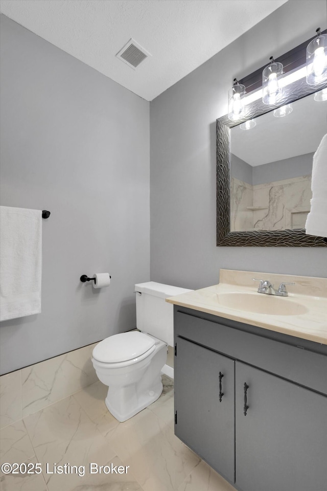 1008 Lake Way Unit D12, Louisville, KY 40222 - bathroom featuring vanity, marble finish floors, toilet, and baseboards