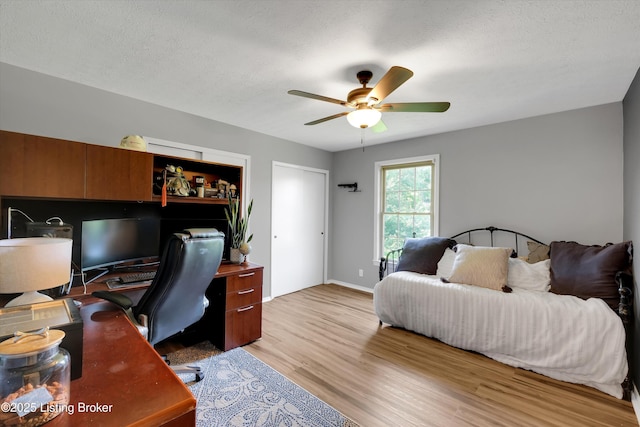 1008 Lake Way Unit D12, Louisville, KY 40222 - bedroom with light wood finished floors, a desk, ceiling fan, and baseboards