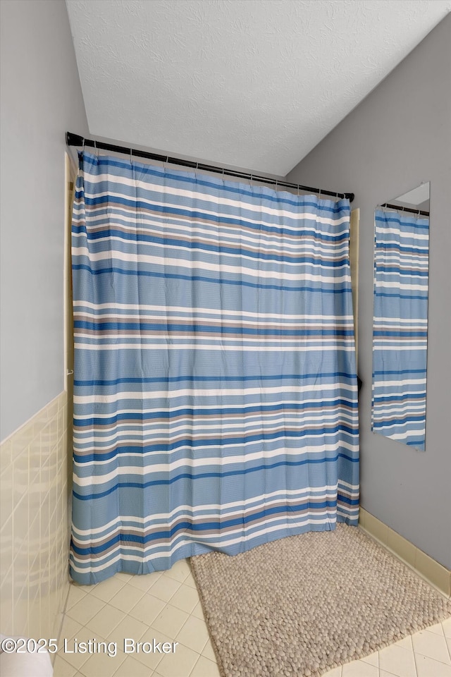 1008 Lake Way Unit D12, Louisville, KY 40222 - full bathroom with tile patterned floors, a textured ceiling, and a shower with shower curtain