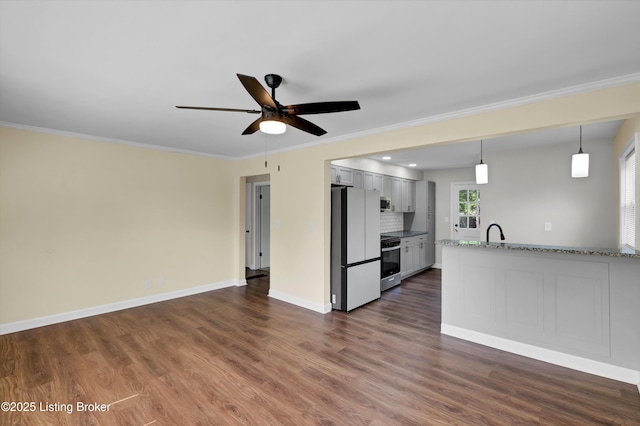 4512 Grandview Dr, Louisville, KY 40216 - kitchen with appliances with stainless steel finishes, a ceiling fan, dark wood-type flooring, crown molding, and a sink