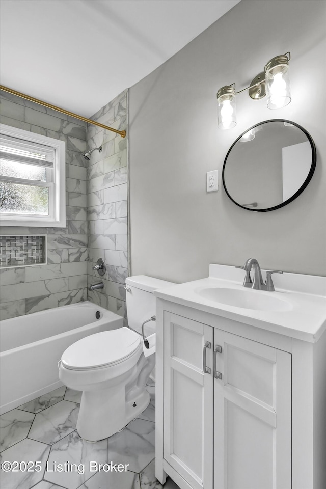 4512 Grandview Dr, Louisville, KY 40216 - full bath with marble look tiles, vanity, shower / tub combination, and toilet