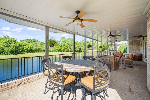 14702 Forest Oaks Dr, Louisville, KY 40245 - sunroom featuring a ceiling fan, a water view, and outdoor dining area