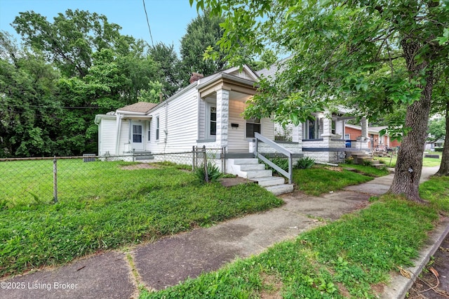 209 W Kenton St, Louisville, KY 40214 - shotgun-style home featuring a chimney